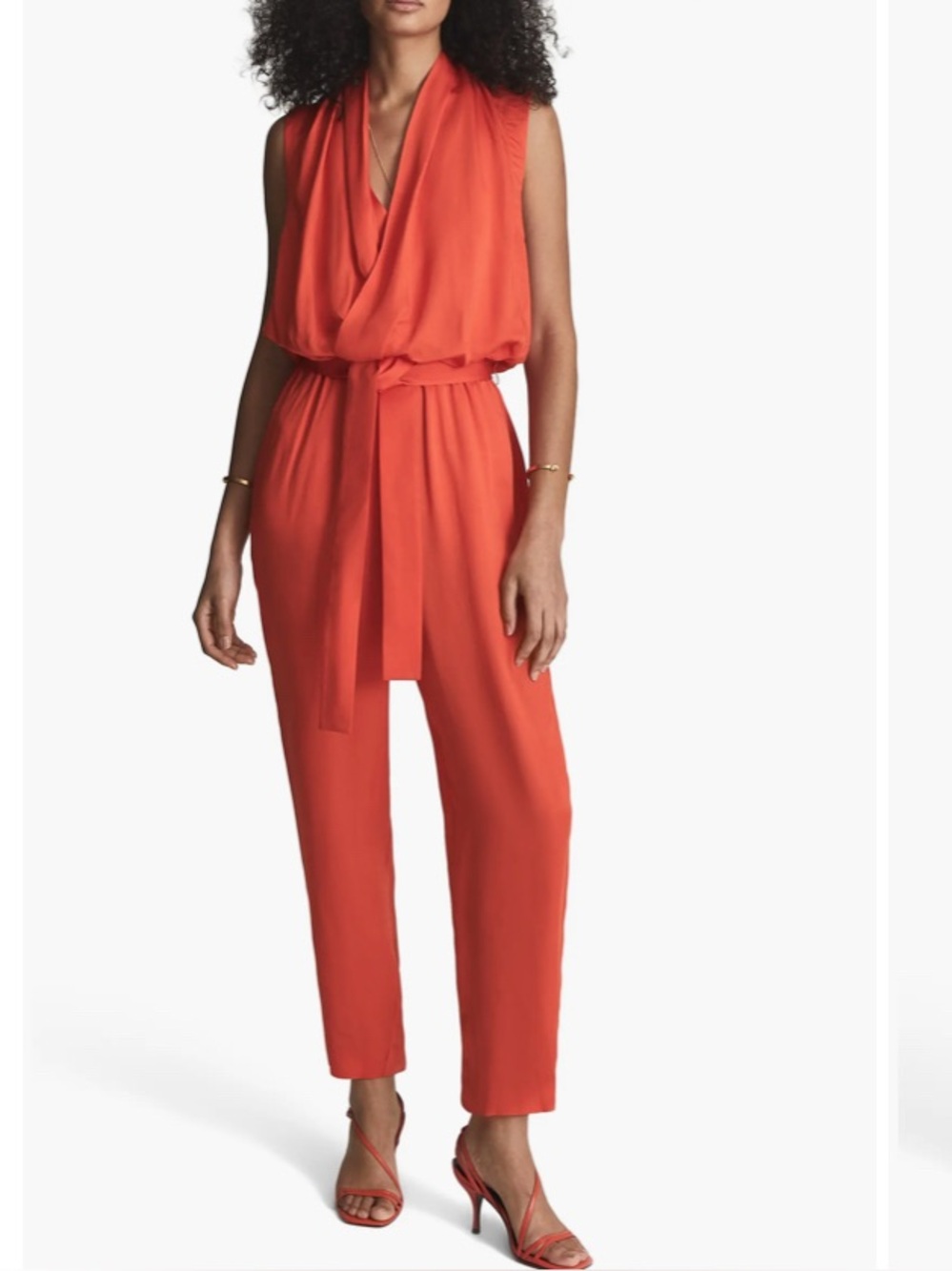 Reina’s coral orange jumpsuit